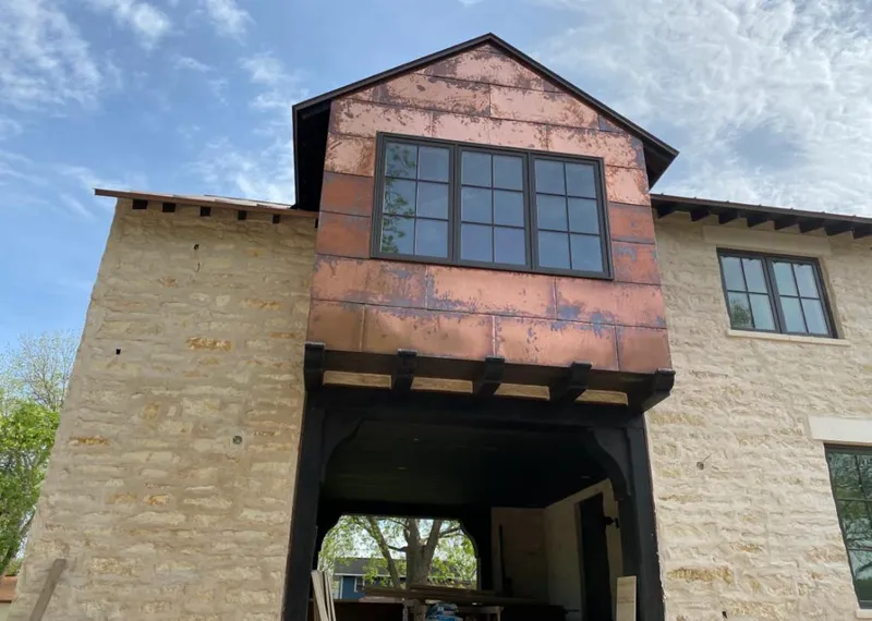 Copper metal panel facade on a stone building for Metal Roof Coating in La Quinta